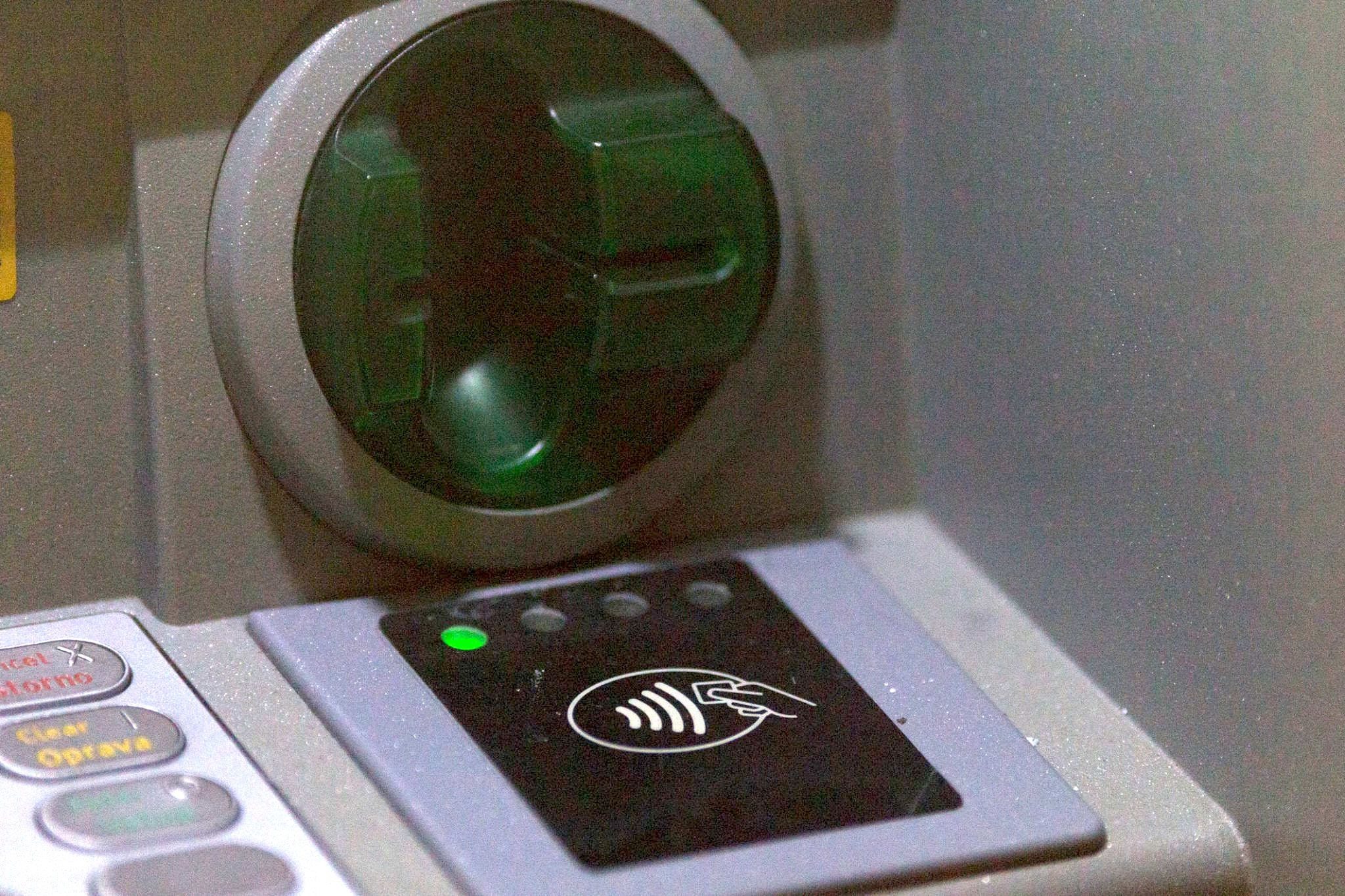 Close-up of the contactless NFC reader on a Blue Sky ATM, with green ready light illuminated